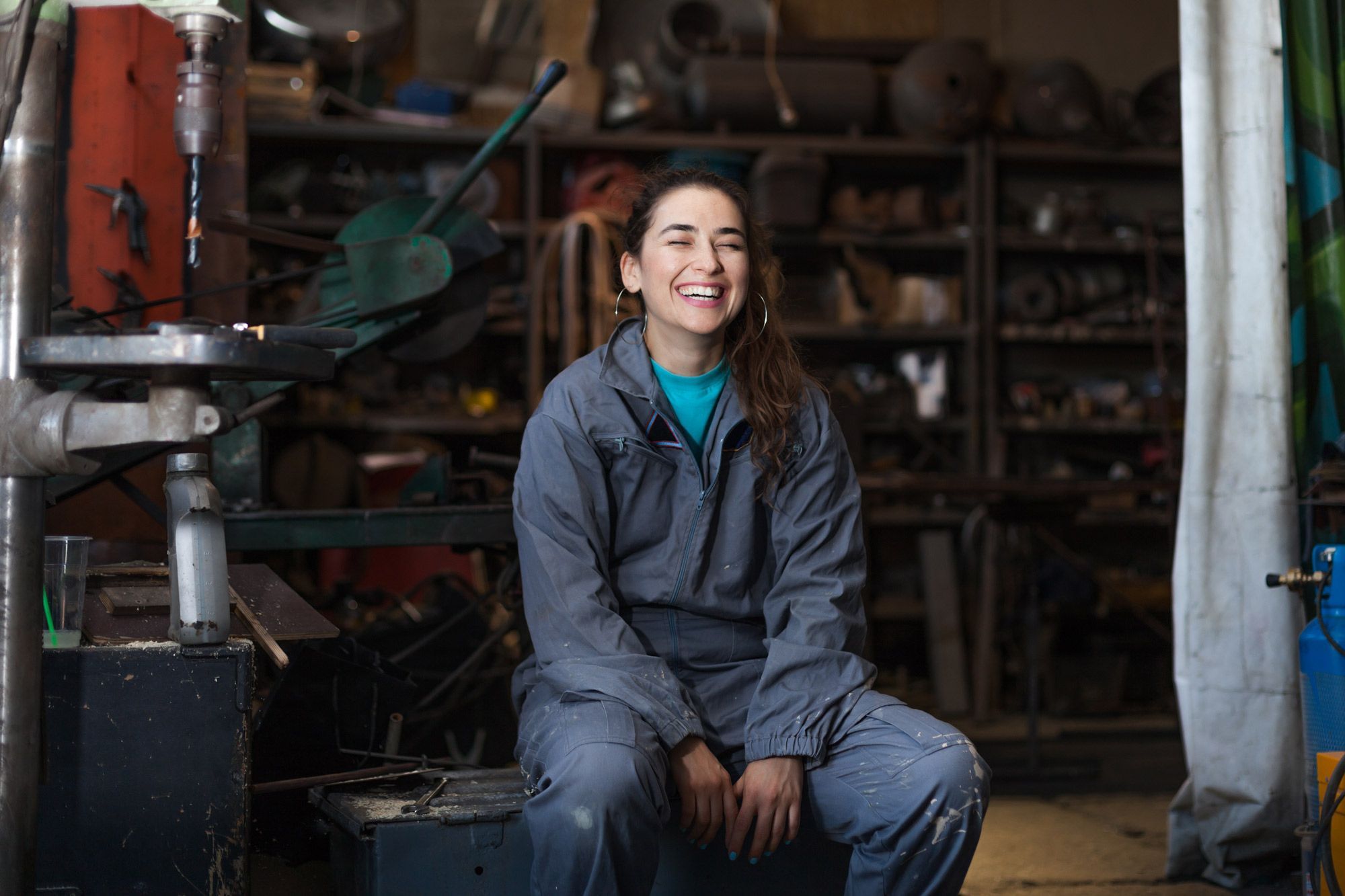 Girl in a workshop smiling